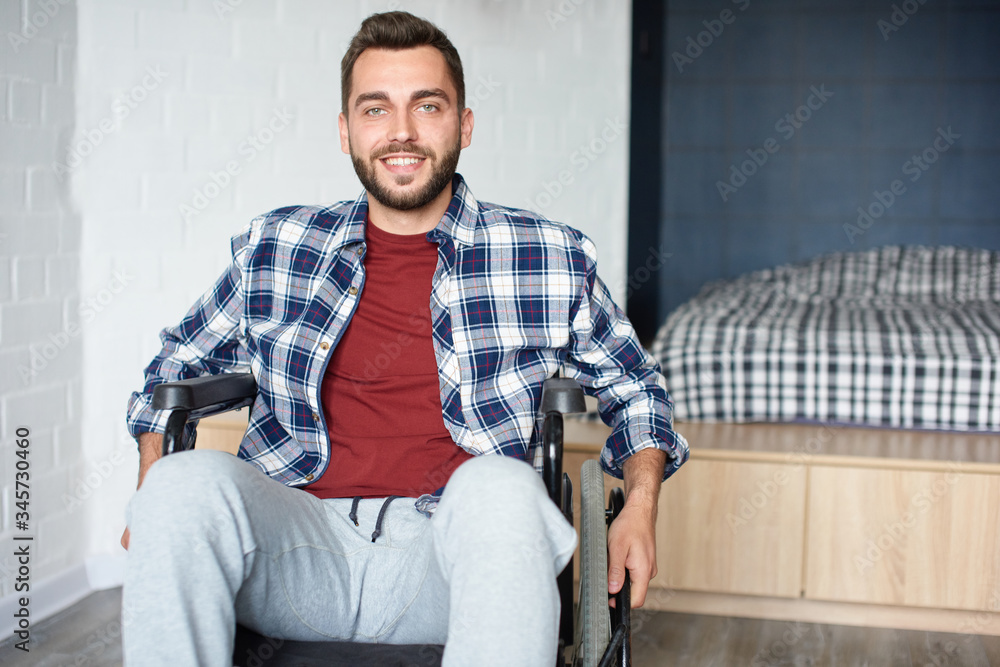 Smiling young disabled person in a wheelchair Smiling young disabled person in a wheelchair