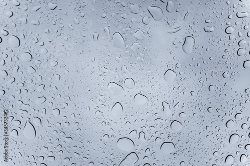 Raindrops on the window during storm, Europe