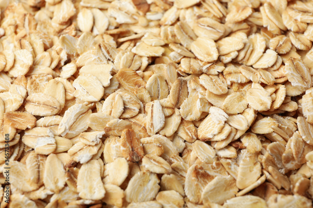 Oatmeal flakes texture on whole background, close up Oatmeal flakes texture on whole background, close up