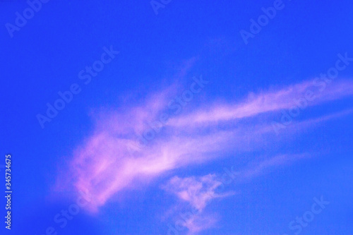 Reddish blue sky with small cloud