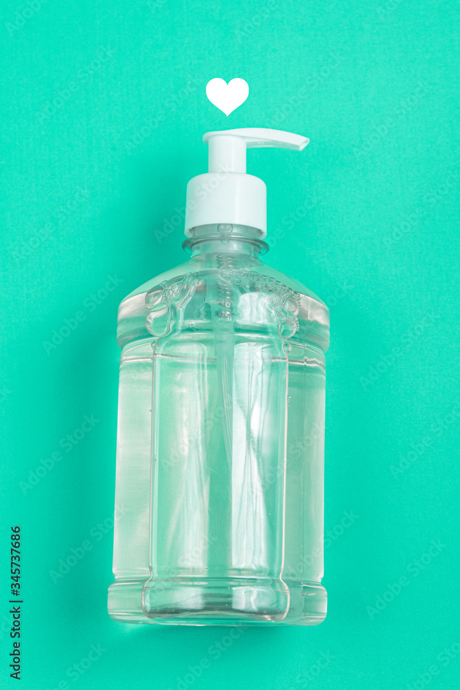 Container with alcohol gel on the light blue background Container with alcohol gel on the light blue background