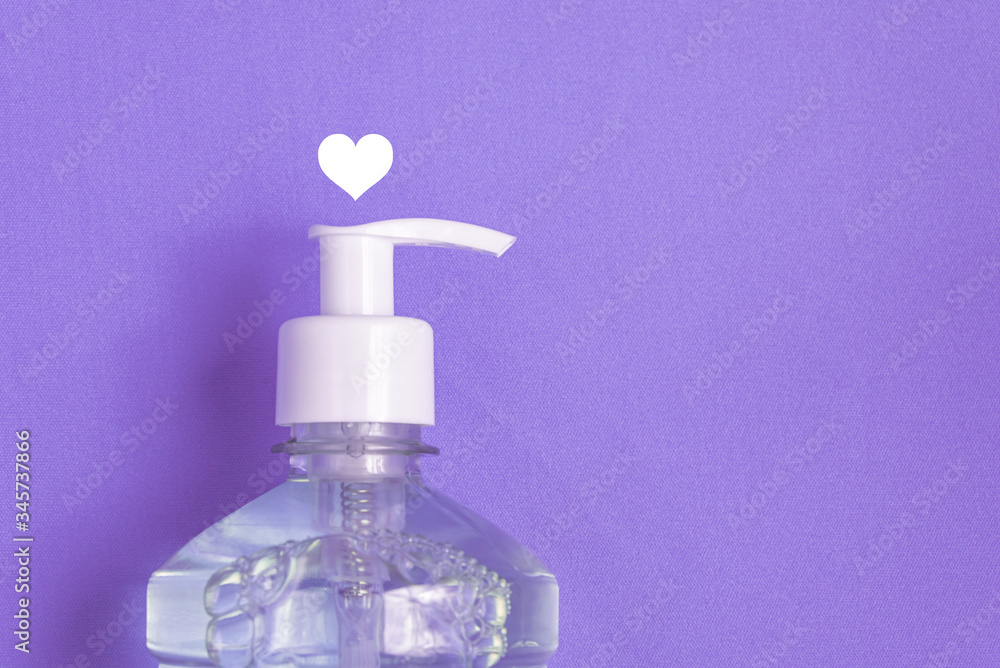 Container with alcohol gel on the light blue background Container with alcohol gel on the light blue background