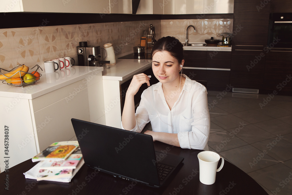 Young woman works, studies at laptop at home. Working from home. Concept home quarantine, prevention COVID-19, Coronavirus outbreak situation
Young woman works, studies at laptop at home. Working from home. Concept home quarantine, prevention COVID-19, Coronavirus outbreak situation