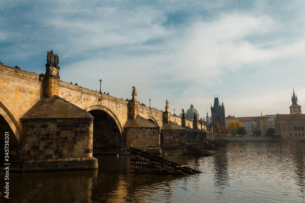 View of the Charles Bridge and the Vltava River in Prague in the fall. autumn.