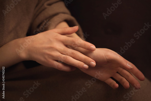 close up of a woman holding her hands © Alice
