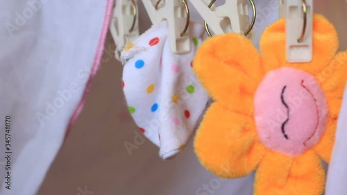 baby socks and toys hang on rack