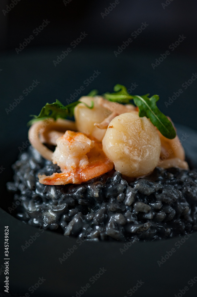 Black risotto with shrimp, scallops and cuttlefish ink.