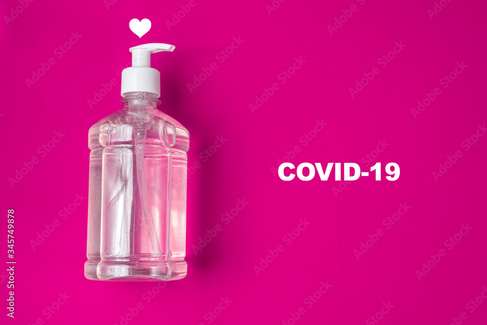 Container with alcohol gel on the red background Container with alcohol gel on the red background