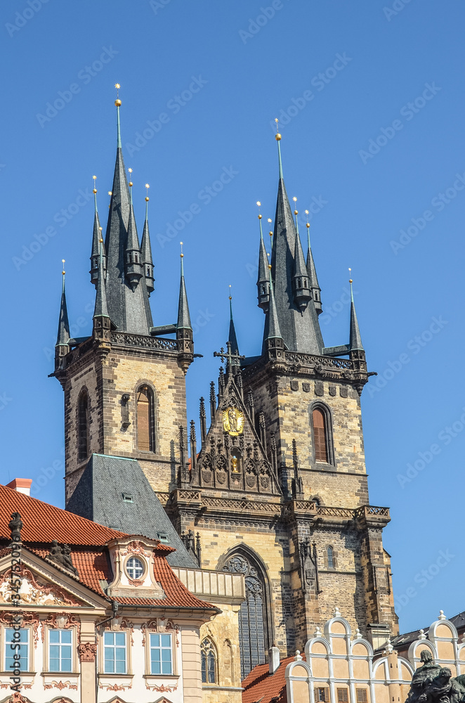 Historical buildings in the old town with the front side of the Church of Our Lady before Tyn in Prague, Czech Republic. Old Town Square in Praha, Czechia. Tourist landmarks. Vertical photo.