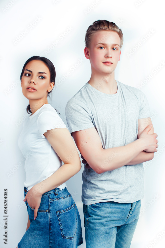 modern hipster guys together couple diverse nations, asian girl and caucasian blond boy isolated on white background, lifestyle people concept modern hipster guys together couple diverse nations, asian girl and caucasian blond boy isolated on white background, lifestyle people concept