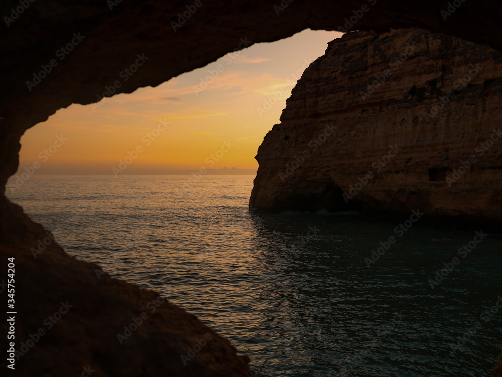 Sunset on the background of rocks, Algarve, Portugal.