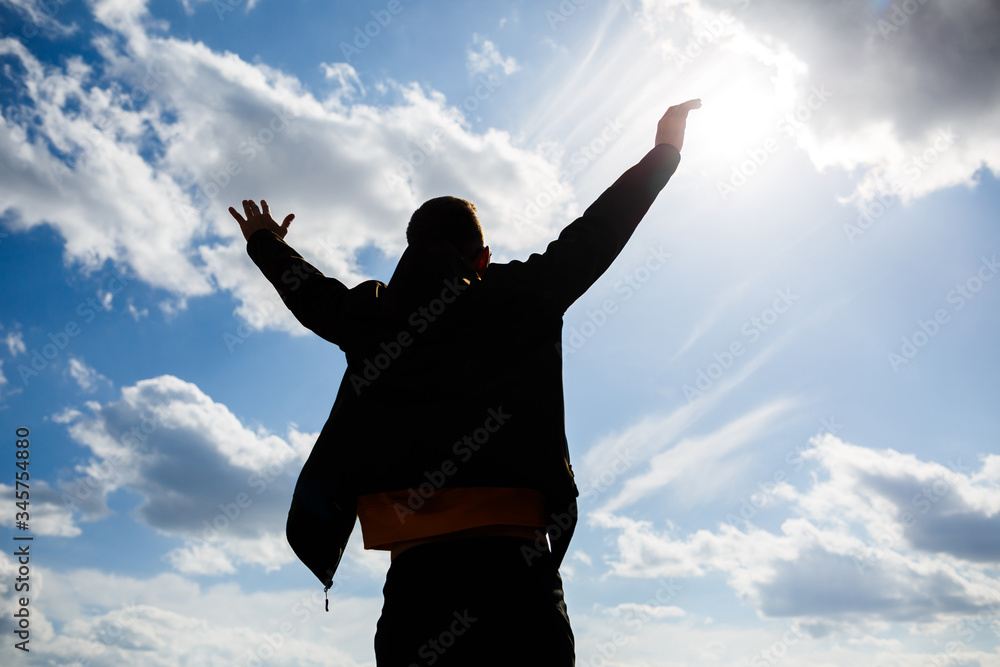 guy tourist freelancer on a background of blue sky with white clouds, bright sunny day, nature and human freedom guy tourist freelancer on a background of blue sky with white clouds, bright sunny day, nature and human freedom