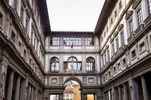 Inner courtyard of the famous Galleria degli Uffizi in Florence  Tuscany  Italy. Historical building with columns and arches. Medieval 16th century building. Tourist attraction