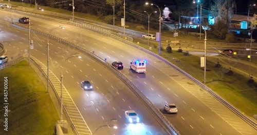 Aerial view of an ambulance driving at night, high quality footage, Ukraine