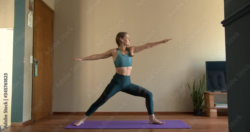 Beautifull athletic woman doing yoga and meditation inside her house Beautifull athletic woman doing yoga and meditation inside her house