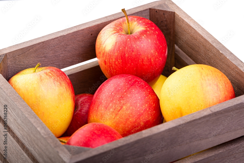 Apples in a wooden crate. Isolate on white background Apples in a wooden crate. Isolate on white background