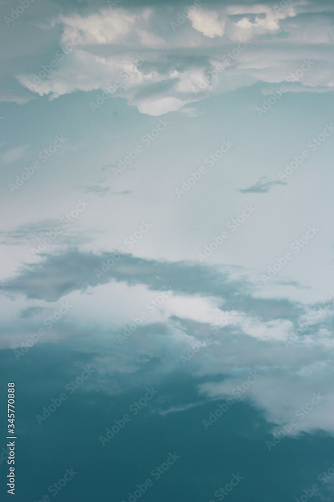 Blurry image of Blue Sky And White Clouds. Horizontal Shot Of A Beautiful Sky Background. Heaven, Nature, Landscapes Concept. Blurry image of Blue Sky And White Clouds. Horizontal Shot Of A Beautiful Sky Background. Heaven, Nature, Landscapes Concept.