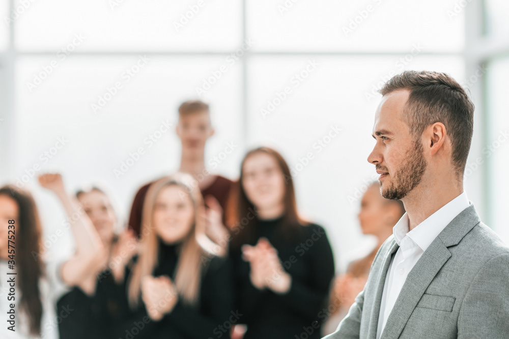 side view. young business man standing in conference room side view. young business man standing in conference room