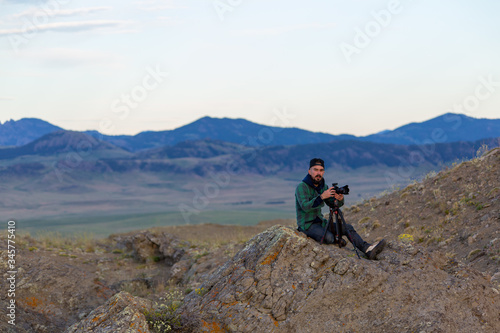 photographer on top of mountain 