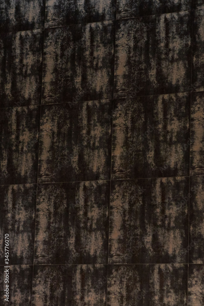 Brown stone tiles, background, texture, selective focus Brown stone tiles, background, texture, selective focus