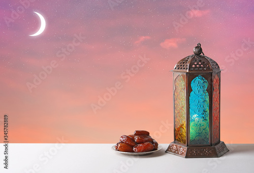 Traditional Ramadan lantern and dates on table. Muslim holiday photo