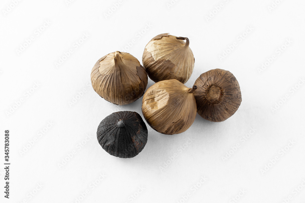 A group of black garlic, solo garlic bulb. A food ingredient, or commonly used for holistic food theraphy. A group of black garlic, solo garlic bulb. A food ingredient, or commonly used for holistic food theraphy.