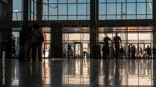 silhouettes of business people in the lobby of the business center