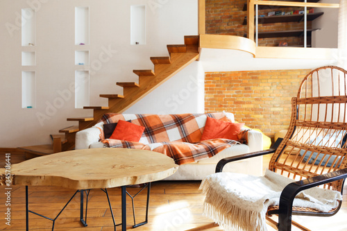 Modern cozy loft. Chair, table and sofa photo