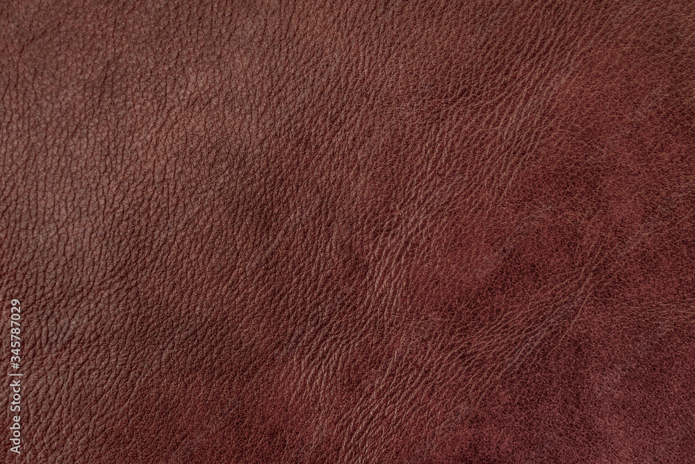 Texture of genuine leather, dark brown color, background, surface. Manufacturing and leather industry concept Texture of genuine leather, dark brown color, background, surface. Manufacturing and leather industry concept