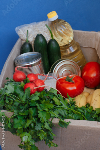 Donation box with food on a blue background