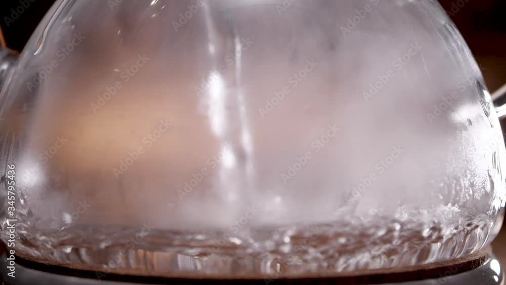 pour boiling water into a glass teapot pour boiling water into a glass teapot