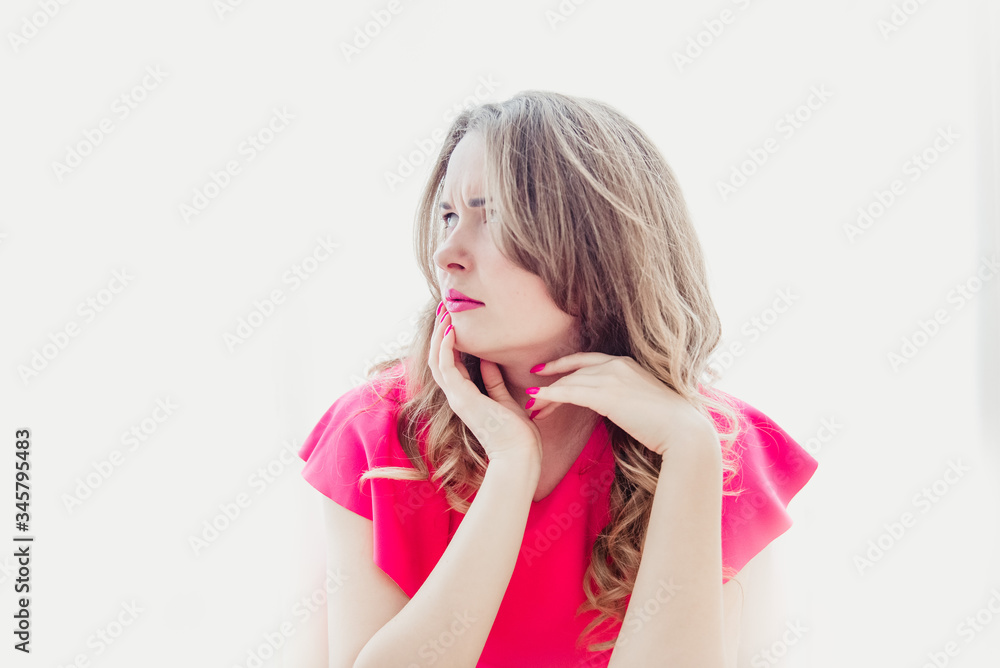 A girl in a pink blouse on a white background with pink lips and nails A girl in a pink blouse on a white background with pink lips and nails