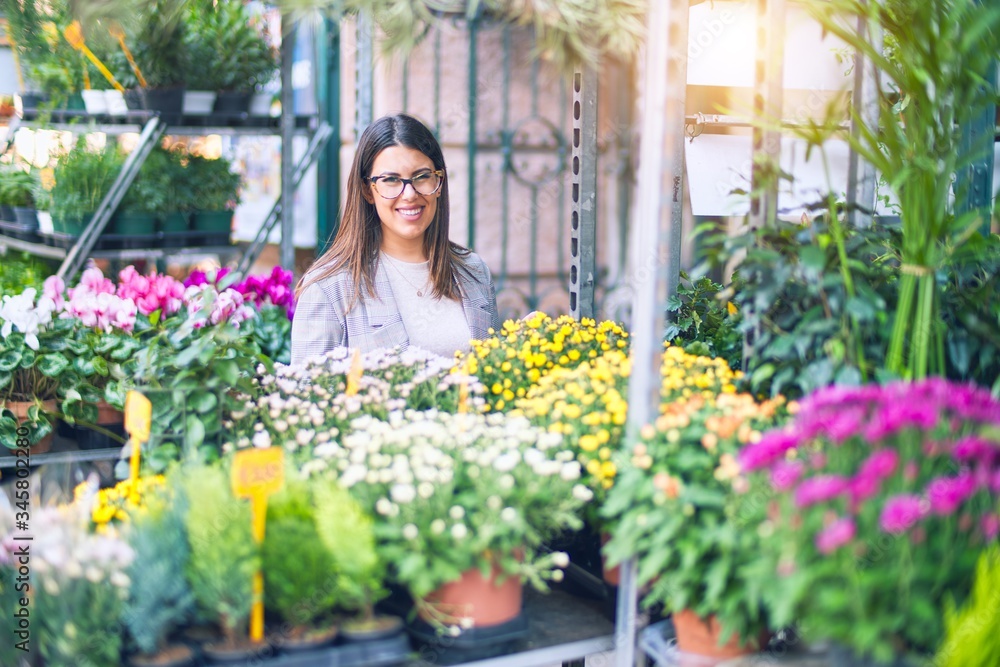 Young beautiful woman smiling happy and confident. Standing with smile on face at florist