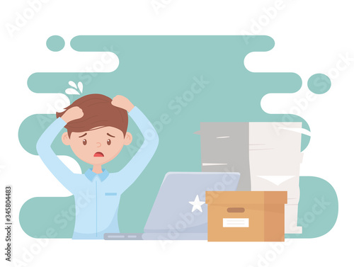 stress at work, worried employee working many papers laptop and box