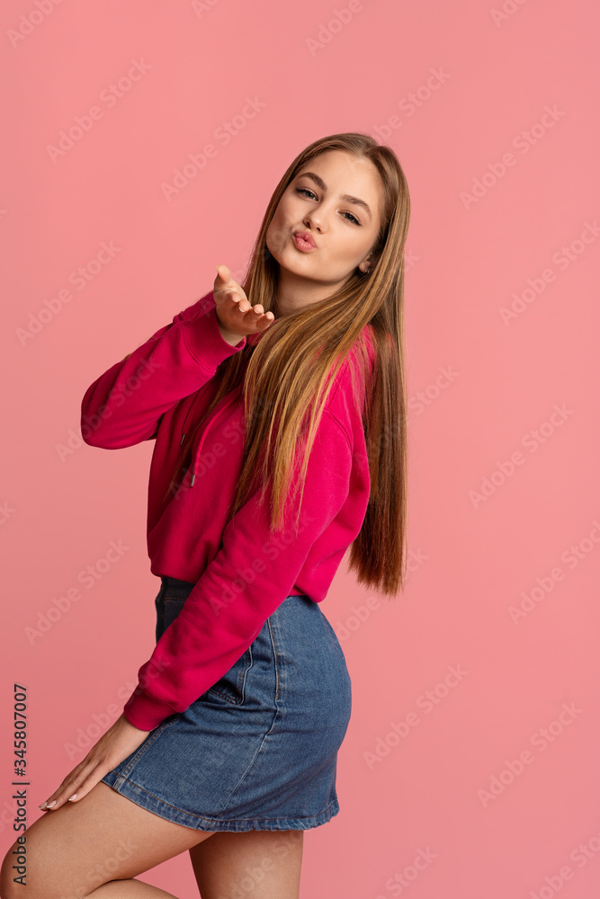 Teen girl sends blowing kiss to camera Teen girl sends blowing kiss to camera