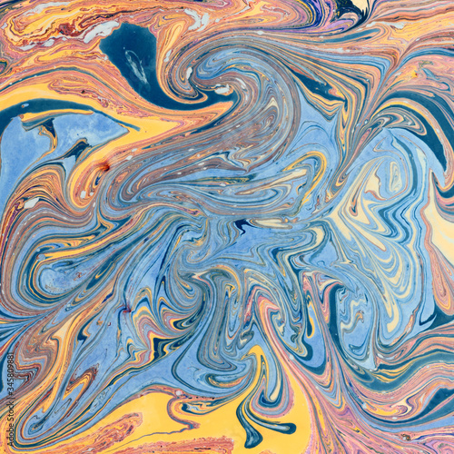 Abstract picture of colorful stains on water. Paper marbling technique.