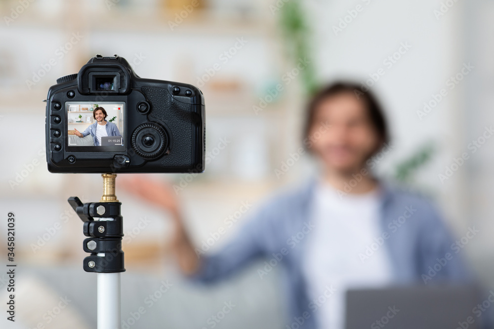 Selective focus on camera shooting video blogger Selective focus on camera shooting video blogger