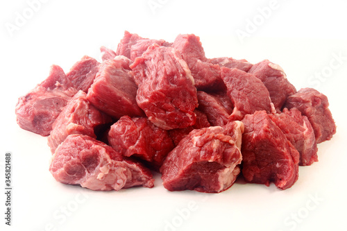 pile of diced chopped raw beef cube isolated on white background