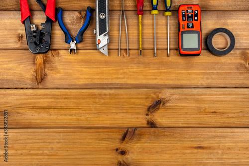 Set of hand repair tools on a wooden background with copy space. Do it yourself (DIY) concept. Top view