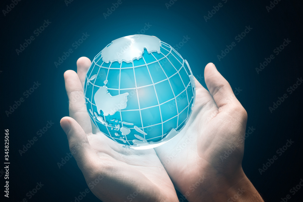 Earth day concept. Collage with male hands holding planet, dark background Earth day concept. Collage with male hands holding planet, dark background