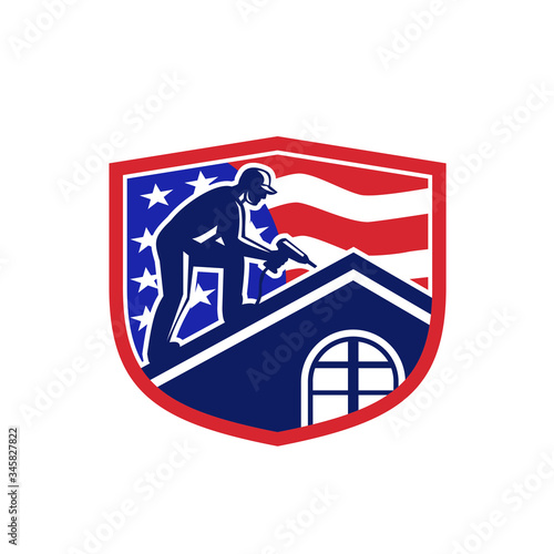 Illustration of an American roofer construction worker working on roof with hand drill and USA stars and stripes flag viewed from side set inside shield crest done in retro style. 