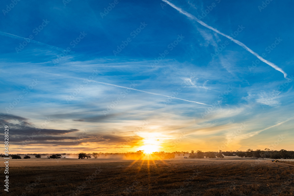 Vast view of rural farming landscape as the sun sets over the land Vast view of rural farming landscape as the sun sets over the land