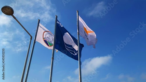 Expresive Waving Cyprus Flags on a Sunny Travel Day photo