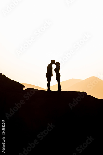 Couple in love hugging in the sunset. Wedding in Majorca by the sea.