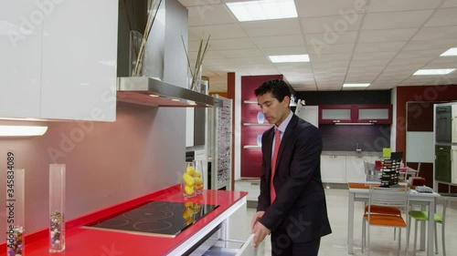 Wallpaper Mural WS DS TS Salesman showing kitchen furniture in showroom Torontodigital.ca