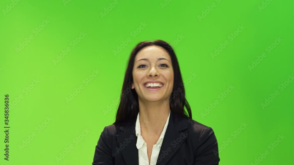 MS Female presenter in front of green screen in TV studio talking to camera MS Female presenter in front of green screen in TV studio talking to camera