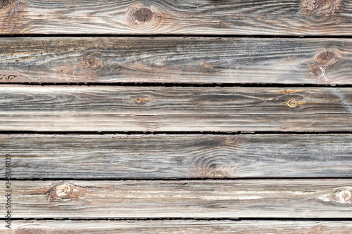 Rustic stiile. Old horizontal boards. Wooden peeling wall. Textured Background.
