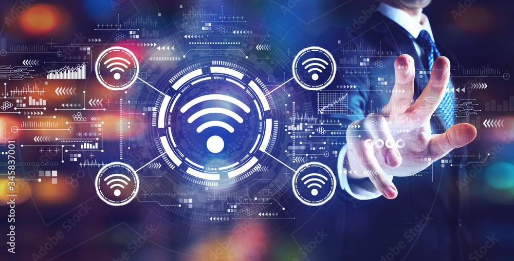 Obraz premium Wifi theme with businessman on night city background