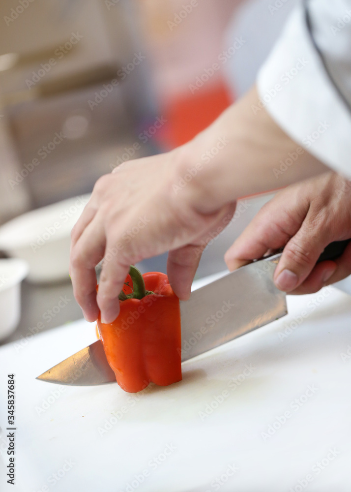 Chef cooking, Chef preparing food in the kitchen, Chef decorating dish, closeup. Chef cooking, Chef preparing food in the kitchen, Chef decorating dish, closeup.
