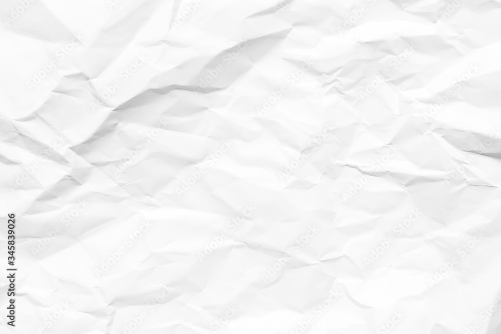 White crumpled paper texture background. Clean white paper. Top view. White crumpled paper texture background. Clean white paper. Top view.